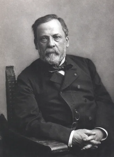 Paul Nadar's portrait of Louis Pasteur: an elderly, serious man in a dark suit and bow tie