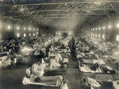 Patients in rows of beds at an emergency military hospital at Camp Funston, Kansas, during the 1918 influenza epidemic