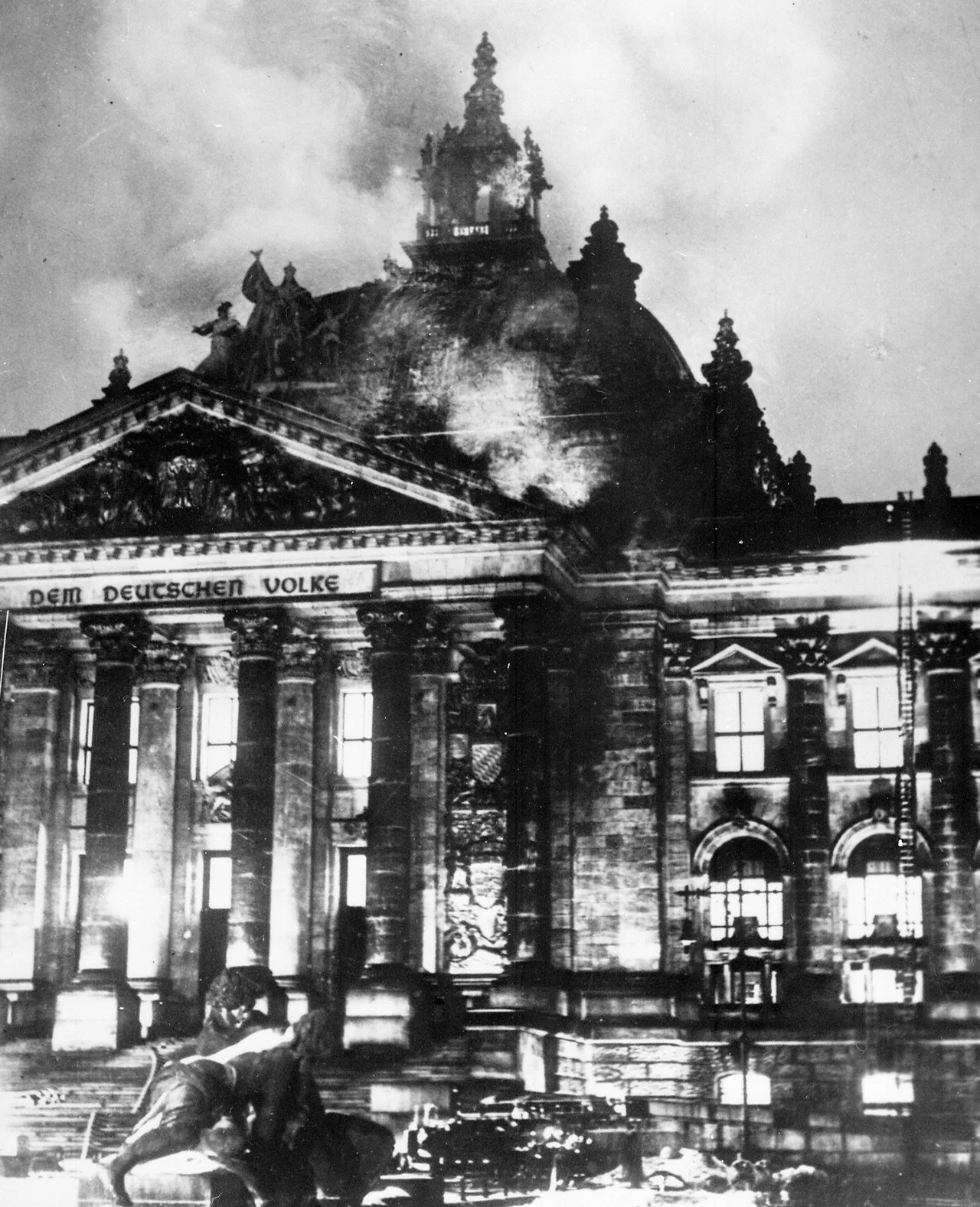 Firefighters at work on the burning Reichstag building on the night of 27 February 1933