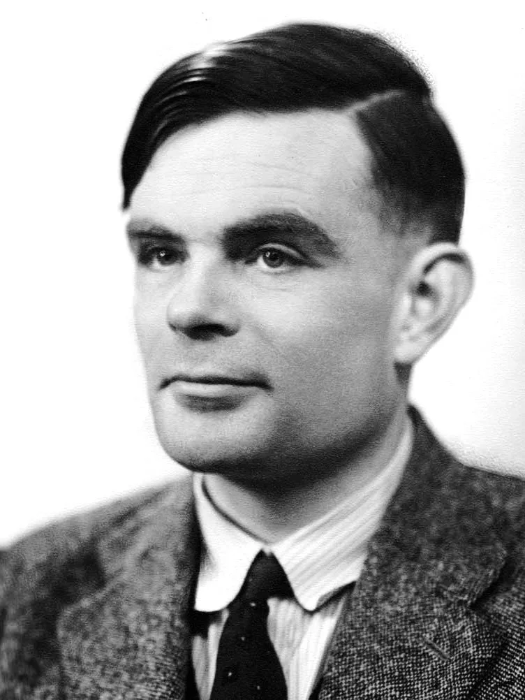 Black-and-white portrait of a young Alan Turing in a suit, with a serious expression