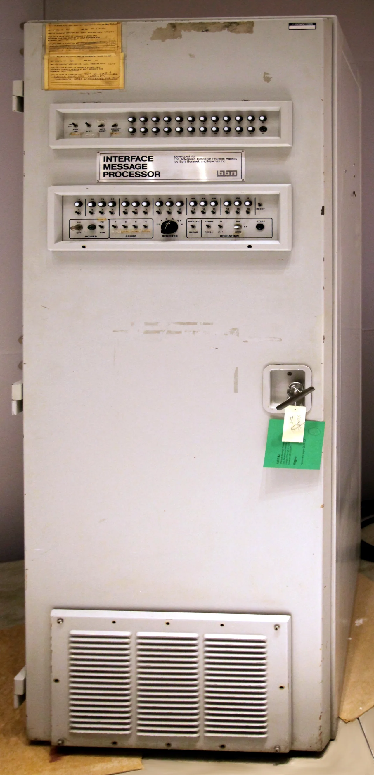 ARPANET's first router (Interface Message Processor): a fridge-tall grey-green electronic cabinet with baseball-sized indicator buttons