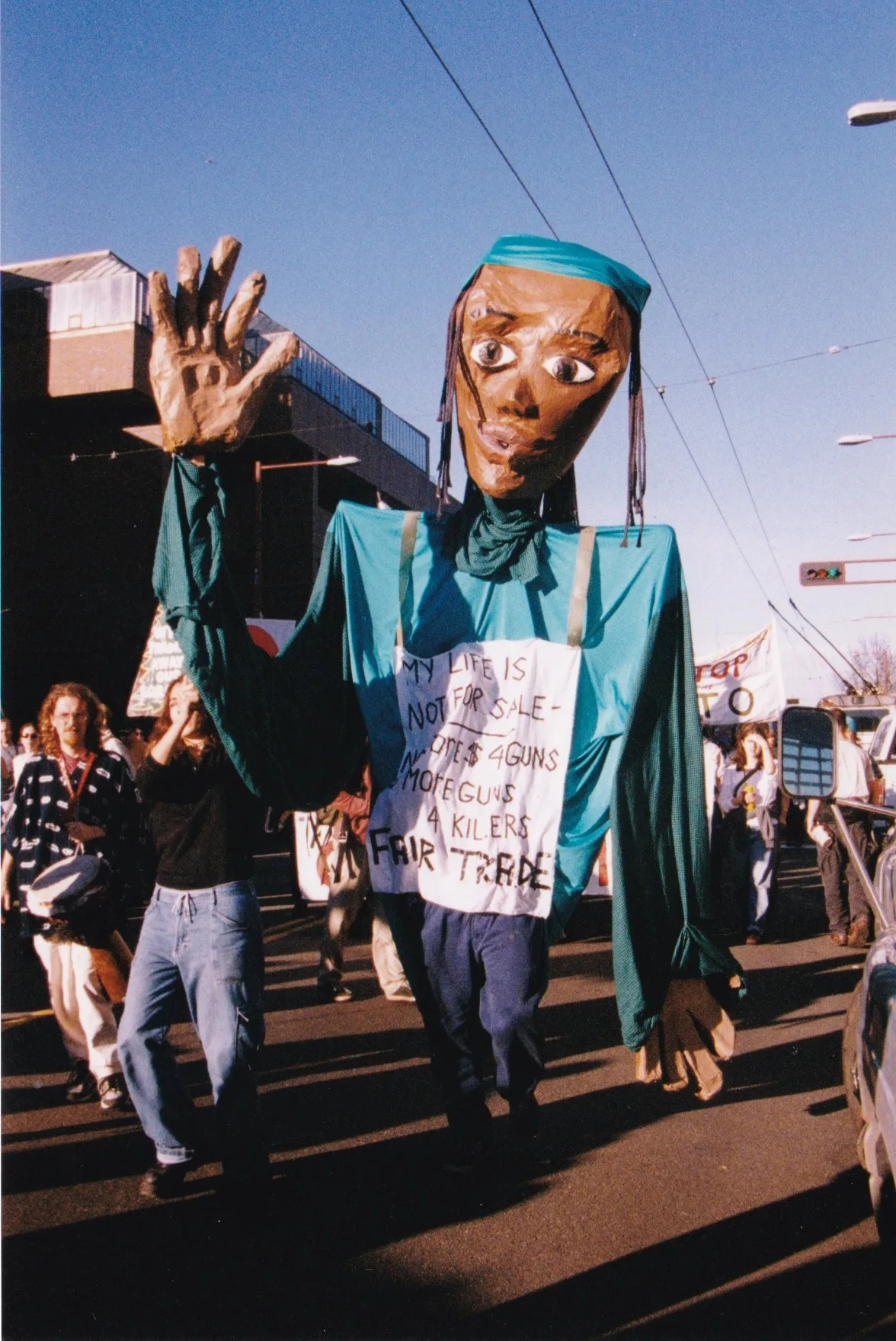 Puppet-bearing marchers protesting the WTO Ministerial Conference in Seattle, December 1999