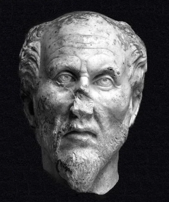 A marble head identified with Plotinus — broken through the neck and across the middle, restored, with austere features; Ostiense Museum, Ostia Antica