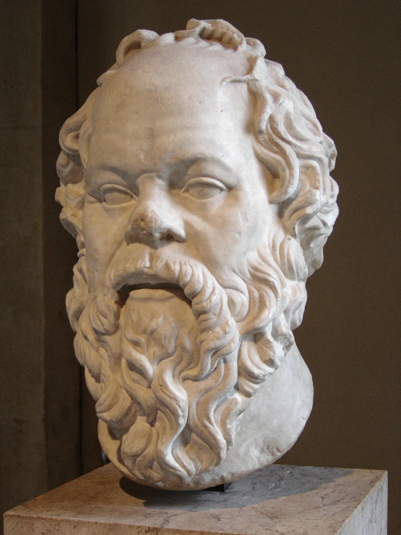 The marble bust of Socrates at the Louvre — the head of an older, bearded man with a broad forehead