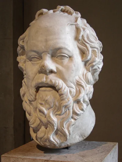 The marble bust of Socrates at the Louvre — the head of an older, bearded man with a broad forehead