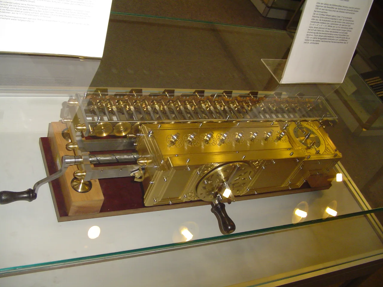 Leibniz's Stepped Reckoner, a mechanical calculating machine in a wooden case with stepped cylindrical gears
