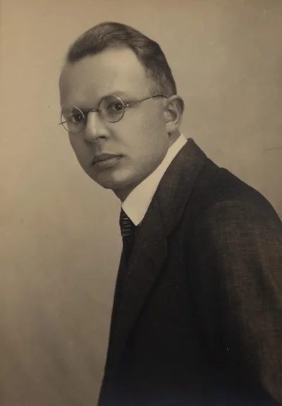 A 1930 black-and-white half-profile portrait of the young philosopher Rudolf Carnap, with glasses and a serious gaze