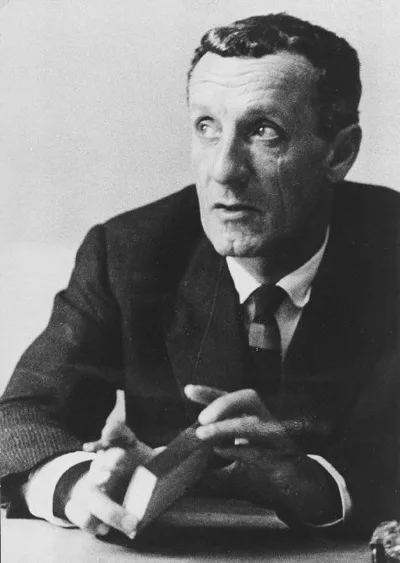 Portrait of Maurice Merleau-Ponty: a middle-aged man in a suit with a thoughtful expression