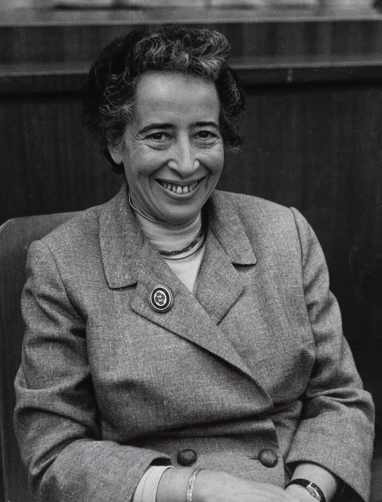 Black-and-white portrait of Hannah Arendt seated as a participant at the First Cultural Critics Congress in Munich in 1958 — short hair, holding a cigarette