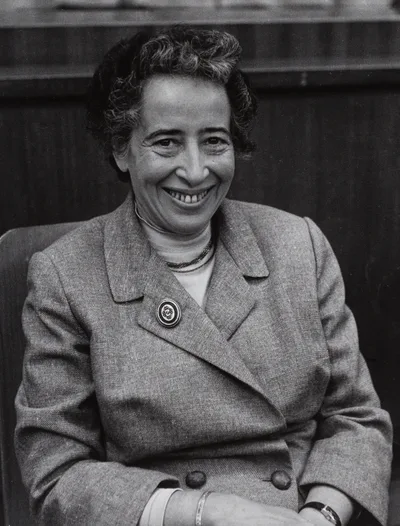 Black-and-white portrait of Hannah Arendt seated as a participant at the First Cultural Critics Congress in Munich in 1958 — short hair, holding a cigarette
