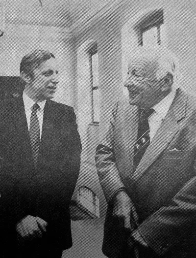 Black-and-white photograph of Hans-Georg Gadamer in conversation with a colleague
