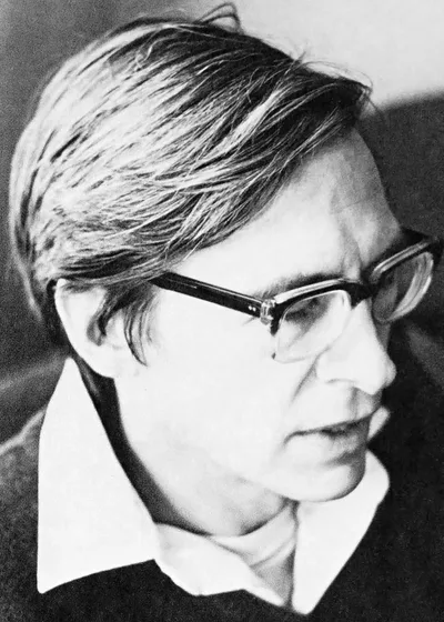 Portrait photograph of John Rawls, 1971: a calm, bespectacled, middle-aged academic in a suit