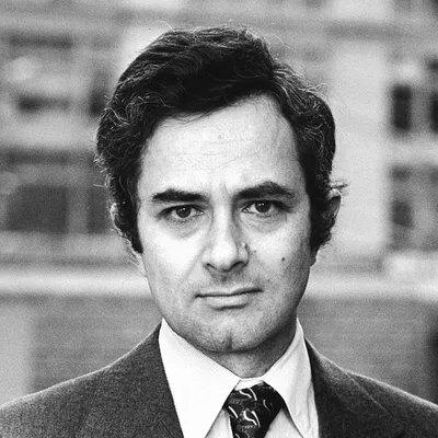 Portrait photograph of Thomas Nagel: an elderly man with white hair and glasses looking at the camera