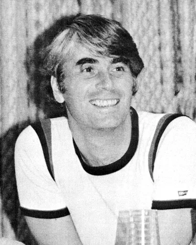 A portrait photograph of Robert Nozick from a 1977 magazine cover: a middle-aged man with thick hair, smiling