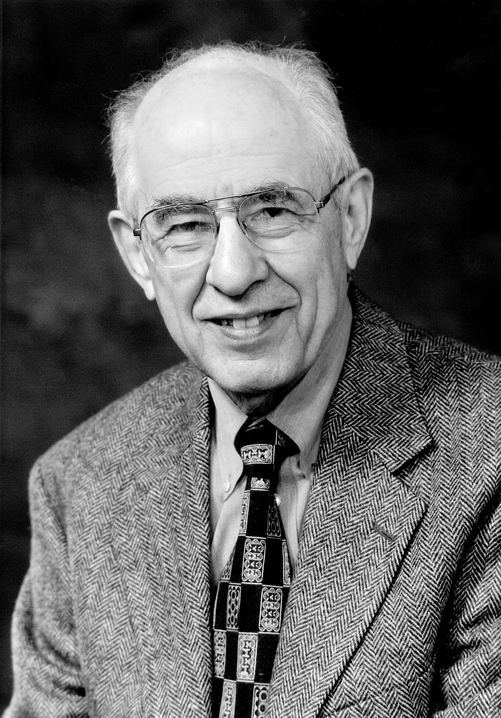 Portrait photograph of Hilary Putnam: white-haired and bespectacled, caught while speaking