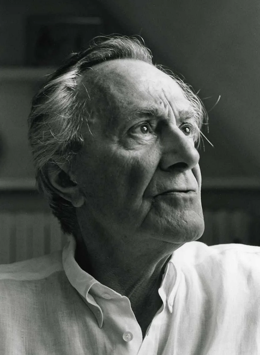 A portrait of Jean-François Lyotard: an older French philosopher with short white hair, glasses, and a thoughtful expression