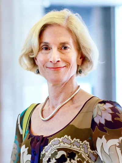 A 2010 photograph of Martha Nussbaum: a middle-aged woman with dark hair, speaking